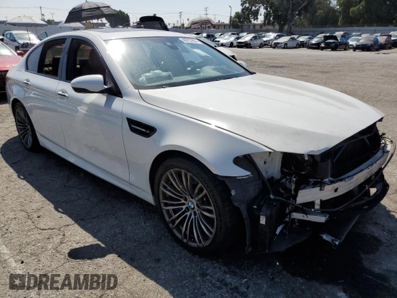 2014 BMW M5 with VIN WBSFV9C57ED097570, listed as a Copart auction lot 69757854 with 0 mi miles and Salvage Title. Bid and sale history available at carsss.com. Image 4.
