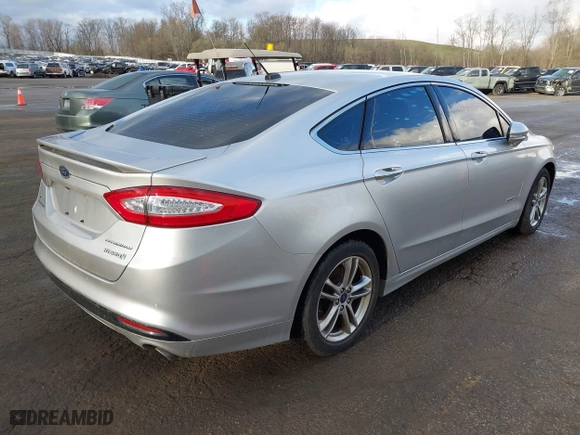 2015 Ford Fusion Titanium Hybrid with VIN 3FA6P0RU8FR181312, listed as a IAAI auction lot 42071584 with 99,955 mi miles. Bid and sale history available at carsss.com. Image 4.