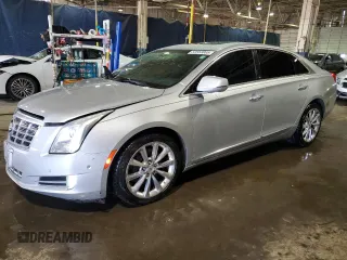 2014 Cadillac XTS Luxury z VIN 2G61M5S30E9325292, wystawiony jako Copart lot #52553865 z przebiegiem 146 618 mil mil oraz Czysty tytuł • Clean title. Historia ofert i sprzedaży dostępna na DreamBid. Obrazek 1.