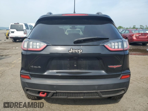 2019 Jeep Cherokee Trailhawk z VIN 1C4PJMBXXKD471338, wystawiony jako Copart lot #59880765 z przebiegiem 59 546 mil mil oraz Szkoda całkowita • Salvage title. Historia ofert i sprzedaży dostępna na DreamBid. Obrazek 6.