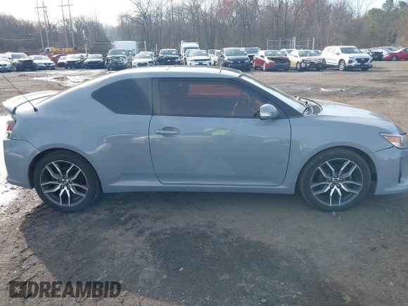 2014 Scion tC z VIN JTKJF5C71E3081033, wystawiony jako IAAI lot #41928949 z przebiegiem 144 112 mil mil oraz . Historia ofert i sprzedaży dostępna na DreamBid. Obrazek 13.