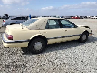 1992 Cadillac Seville z VIN 1G6KS53B0NU837105, wystawiony jako Copart lot #55865205 z przebiegiem 94 740 mil mil oraz Szkody całkowita. Historia ofert i sprzedaży dostępna na DreamBid. Obrazek 3.