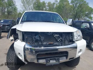 2005 Nissan Titan LE with VIN 1N6AA07BX5N525048, listed as a IAAI auction lot 41984150 with 242,321 mi miles. Bid and sale history available at carsss.com. Image 6.