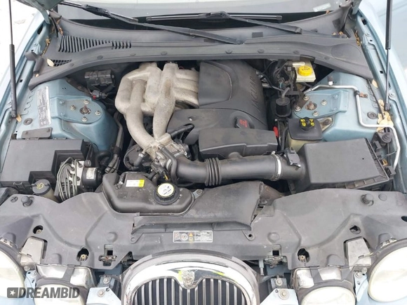 2004 Jaguar S-Type with VIN SAJEA01T44FN03885, listed as a IAAI auction lot 41363610 with 260,228 mi miles. Bid and sale history available at carsss.com. Image 10.