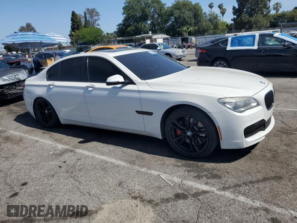 2013 BMW 7 Series 750i with VIN WBAYA8C54DC996412, listed as a Copart auction lot 56982895 with 124,258 mi miles and Salvage title. Bid and sale history available at DreamBid. Image 4.