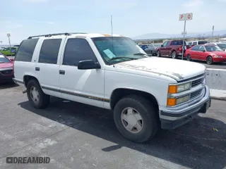 1997 Chevrolet Tahoe with VIN 1GNEK13R6VJ443195, listed as a IAAI auction lot 42000733 with 202,106 mi miles. Bid and sale history available at carsss.com. Image 1.