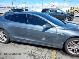 2014 Tesla Model S 60 with VIN 5YJSA1S15EFP29010, listed as a IAAI auction lot 41798180 with 142,754 mi miles and . Bid and sale history available at DreamBid. Image 13.