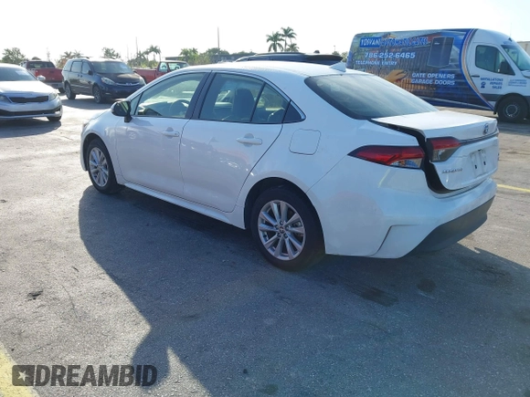 2024 Toyota Corolla Hybrid LE with VIN JTDBCMFE2RJ031865, listed as a IAAI auction lot 41602715 with 10,892 mi miles. Bid and sale history available at carsss.com. Image 3.
