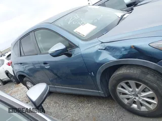 2016 Mazda CX-5 Touring z VIN JM3KE2CY2G0699138, wystawiony jako IAAI lot #42153228 z przebiegiem 144 191 mil mil oraz . Historia ofert i sprzedaży dostępna na DreamBid. Obrazek 13.