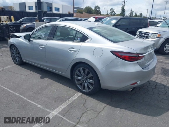 2018 Mazda 6 Grand Touring with VIN JM1GL1TY0J1306768, listed as a IAAI auction lot 41744640 with 81,798 mi miles and . Bid and sale history available at DreamBid. Image 3.