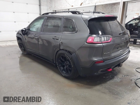 2022 Jeep Cherokee Trailhawk z VIN 1C4PJMBX9ND514703, wystawiony jako IAAI lot #41761037 z przebiegiem 38 499 mil mil oraz . Historia ofert i sprzedaży dostępna na DreamBid. Obrazek 3.