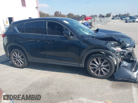 2019 Mazda CX-5 Grand Touring with VIN JM3KFADMXK1547727, listed as a IAAI auction lot 42138071 with Not provided miles and . Bid and sale history available at DreamBid. Image 13.