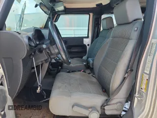 2007 Jeep Wrangler Unlimited Sahara с VIN 1J4GA59167L183198, выставлен на аукционе Copart как лот 62135995 с пробегом Не указан миль и Списание • Salvage title. История ставок и продаж доступна на DreamBid. Изображение 7.