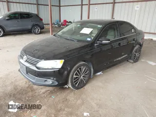 2012 Volkswagen Jetta Sedan SEL w/Sunroof with VIN 3VWLX7AJ5CM379634, listed as a IAAI auction lot 41634048 with 209,586 mi miles. Bid and sale history available at carsss.com. Image 2.