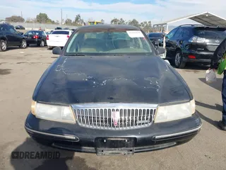1997 Lincoln Continental with VIN 1LNLM97V5VY665410, listed as a IAAI auction lot 41239128 with 66,873 mi miles. Bid and sale history available at carsss.com. Image 12.