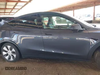 2023 Tesla Model Y Long Range with VIN 7SAYGDEE4PF875915, listed as a IAAI auction lot 42095178 with 11,928 mi miles and . Bid and sale history available at DreamBid. Image 13.
