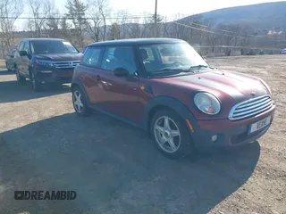 2009 MINI Cooper Hardtop with VIN WMWMF33509TU71339, listed as a IAAI auction lot 41777908 with 155,698 mi miles. Bid and sale history available at carsss.com. Image 1.