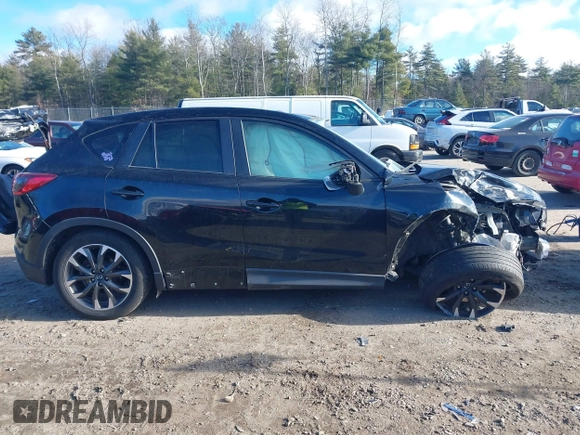 2016 Mazda CX-5 Grand Touring with VIN JM3KE4DY4G0909782, listed as a IAAI auction lot 41006111 with 30,135 mi miles. Bid and sale history available at carsss.com. Image 12.