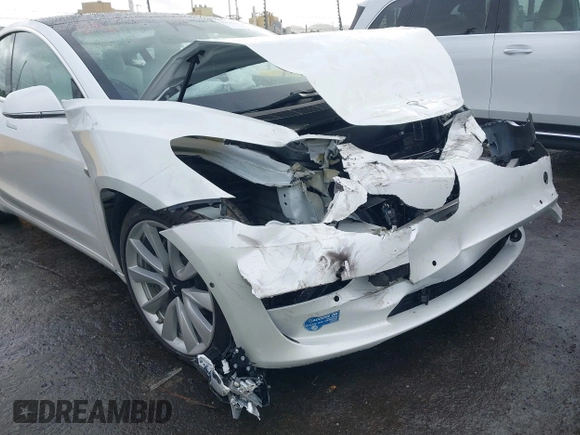 2020 Tesla Model 3 Standard Range Plus with VIN 5YJ3E1EA0LF741311, listed as a IAAI auction lot 41581931 with 43,284 mi miles. Bid and sale history available at carsss.com. Image 19.