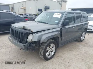 2014 Jeep Patriot Latitude with VIN 1C4NJPFAXED507693, listed as a IAAI auction lot 41701193 with 104,130 mi miles and . Bid and sale history available at DreamBid. Image 2.