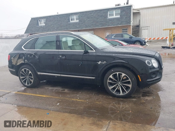 2019 Bentley Bentayga V8 z VIN SJAAM2ZVXKC025218, wystawiony jako IAAI lot #41741586 z przebiegiem 52 457 mil mil oraz . Historia ofert i sprzedaży dostępna na DreamBid. Obrazek 13.