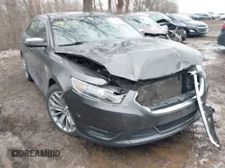 2015 Ford Taurus Limited with VIN 1FAHP2J88FG153326, listed as a IAAI auction lot 41465344 with 98,727 mi miles. Bid and sale history available at carsss.com. Image 1.