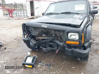 1999 Jeep Cherokee Sport with VIN 1J4FT68S6XL598558, listed as a IAAI auction lot 41549504 with 238,004 mi miles. Bid and sale history available at carsss.com. Image 6.