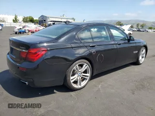 2013 BMW 7 Series 740i with VIN WBAYA6C58DC994974, listed as a Copart auction lot 55534645 with 106,975 mi miles and Salvage title. Bid and sale history available at DreamBid. Image 3.