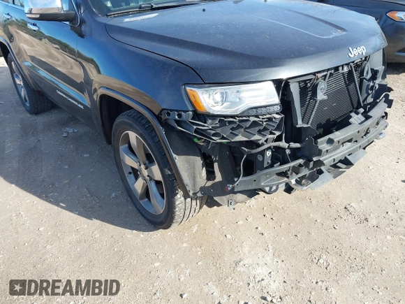 2014 Jeep Grand Cherokee Overland with VIN 1C4RJECG4EC523747, listed as a IAAI auction lot 40802143 with 124,079 mi miles. Bid and sale history available at carsss.com. Image 18.