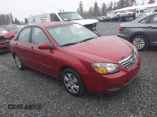 2009 Kia Spectra EX with VIN KNAFE222695621925, listed as a IAAI auction lot 40657622 with 135,647 mi miles. Bid and sale history available at carsss.com. Image 1.