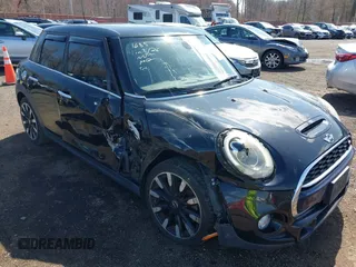2017 MINI Hardtop 4 Door Cooper S z VIN WMWXU3C39H2F48699, wystawiony jako IAAI lot #41924423 z przebiegiem 81 249 mil mil oraz . Historia ofert i sprzedaży dostępna na DreamBid. Obrazek 6.