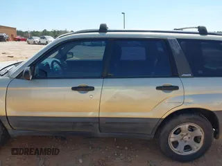 2003 Subaru Forester X z VIN JF1SG63613H715162, wystawiony jako IAAI lot #41897812 z przebiegiem 163 895 mil mil oraz . Historia ofert i sprzedaży dostępna na DreamBid. Obrazek 14.
