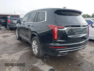 2023 Cadillac XT6 FWD Luxury z VIN 1GYKPAR43PZ147512, wystawiony jako IAAI lot #42175720 z przebiegiem 31 520 mil mil oraz . Historia ofert i sprzedaży dostępna na DreamBid. Obrazek 3.