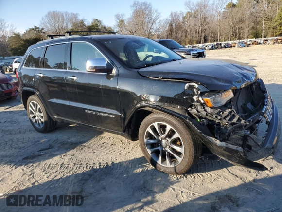2017 Jeep Grand Cherokee Overland with VIN 1C4RJFCT5HC828780, listed as a Copart auction lot 46874965 with 90,269 mi miles and Salvage Title. Bid and sale history available at carsss.com. Image 4.