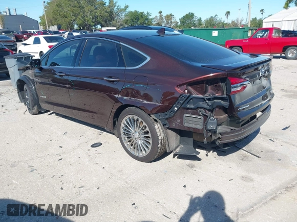 2019 Ford Fusion Hybrid Titanium with VIN 3FA6P0RU2KR123786, listed as a IAAI auction lot 41857026 with 49,604 mi miles. Bid and sale history available at carsss.com. Image 3.