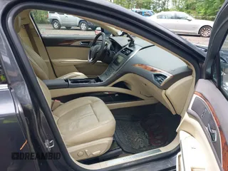 2013 Lincoln MKZ with VIN 3LN6L2J98DR817275, listed as a IAAI auction lot 42196186 with 128,456 mi miles. Bid and sale history available at carsss.com. Image 5.
