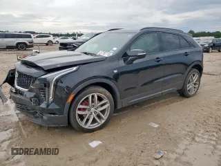 2021 Cadillac XT4 FWD Sport with VIN 1GYFZER48MF034297, listed as a Copart auction lot 57797115 with 55,557 mi miles and Salvage title. Bid and sale history available at DreamBid. Image 1.