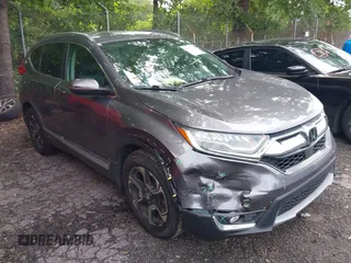 2018 Honda CR-V Touring with VIN 7FARW1H9XJE040530, listed as a IAAI auction lot 42227446 with 101,299 mi miles and . Bid and sale history available at DreamBid. Image 1.