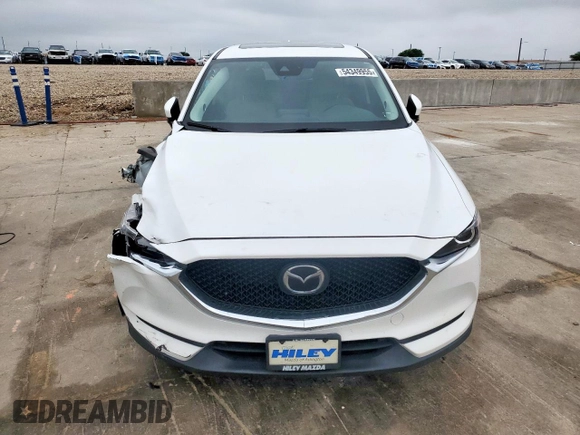 2018 Mazda CX-5 Touring z VIN JM3KFACM0J0469433, wystawiony jako Copart lot #54349955 z przebiegiem Nie podano mil oraz Szkoda całkowita • Salvage title. Historia ofert i sprzedaży dostępna na DreamBid. Obrazek 5.