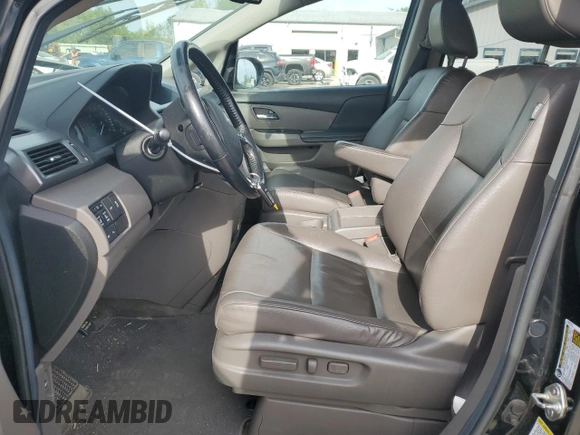 2014 Honda Odyssey Touring z VIN 5FNRL5H94EB006827, wystawiony jako Copart lot #55859715 z przebiegiem 195 131 mil mil oraz Szkoda całkowita • Salvage title. Historia ofert i sprzedaży dostępna na DreamBid. Obrazek 7.