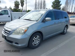 2007 Honda Odyssey EX-L with VIN 5FNRL38727B017587, listed as a IAAI auction lot 41900739 with 216,909 mi miles and . Bid and sale history available at carsss.com. Image 2.