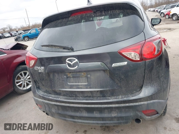 2015 Mazda CX-5 Grand Touring with VIN JM3KE4DY0F0479229, listed as a IAAI auction lot 41838381 with 139,843 mi miles. Bid and sale history available at carsss.com. Image 16.