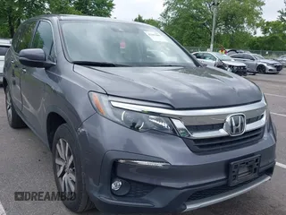 2021 Honda Pilot EX-L with VIN 5FNYF6H56MB092923, listed as a IAAI auction lot 42381900 with 34,334 mi miles and . Bid and sale history available at DreamBid. Image 1.