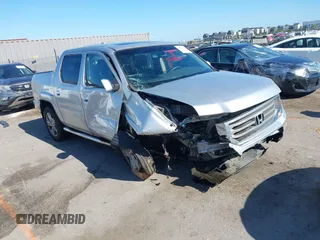 2012 Honda Ridgeline RTL with VIN 5FPYK1F56CB457687, listed as a IAAI auction lot 42582331 with 96,357 mi miles and . Bid and sale history available at DreamBid. Image 1.