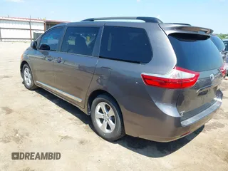 2015 Toyota Sienna LE AAS with VIN 5TDKK3DC4FS617903, listed as a IAAI auction lot 42390155 with 151,975 mi miles and . Bid and sale history available at DreamBid. Image 3.