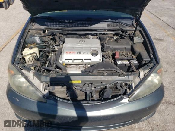 2003 Toyota Camry LE z VIN 4T1BF32K63U559665, wystawiony jako Copart lot #52147645 z przebiegiem 322 212 mil mil oraz Szkoda całkowita • Salvage title. Historia ofert i sprzedaży dostępna na DreamBid. Obrazek 11.