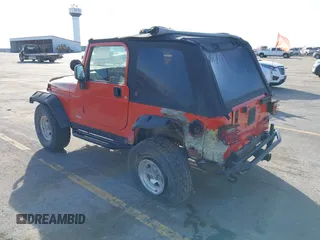 2005 Jeep Wrangler Sport with VIN 1J4FA49S85P344204, listed as a IAAI auction lot 41769319 with 105,927 mi miles. Bid and sale history available at carsss.com. Image 3.