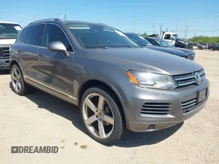 2011 Volkswagen Touareg Sport with VIN WVGFF9BP7BD004979, listed as a IAAI auction lot 41988313 with Not Provided miles and . Bid and sale history available at DreamBid. Image 1.