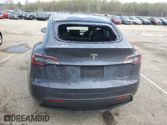 2023 Tesla Model Y Long Range with VIN 7SAYGDEE2PA024693, listed as a Copart auction lot 52595935 with 35,179 mi miles and Salvage Title. Bid and sale history available at DreamBid. Image 6.