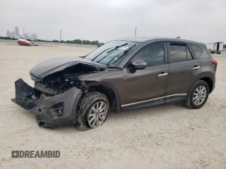 2016 Mazda CX-5 Touring z VIN JM3KE2CY7G0808578, wystawiony jako Copart lot #57466175 z przebiegiem 77 561 mil mil oraz Szkody całkowita. Historia ofert i sprzedaży dostępna na DreamBid. Obrazek 1.